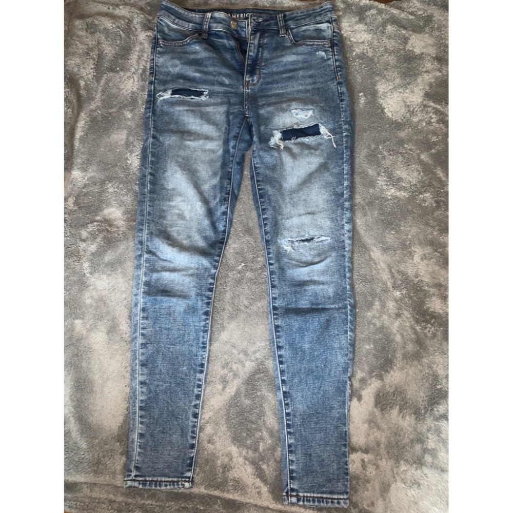 Washed blue jeans jeans